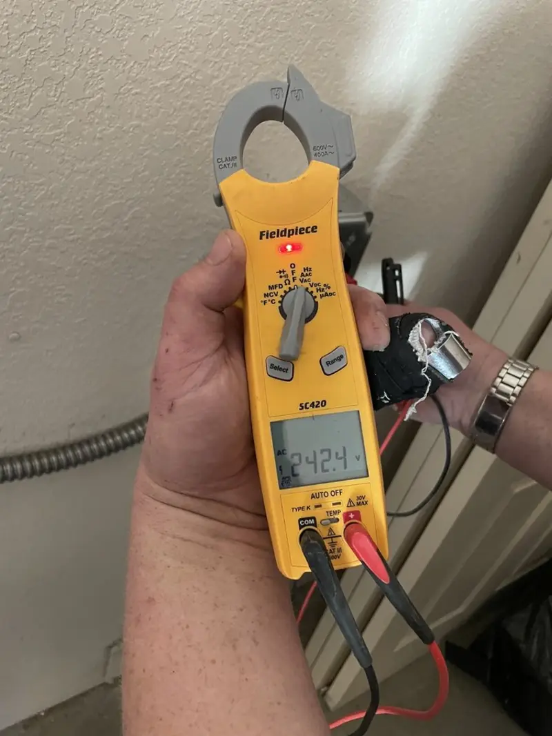 Voltage testing with clamp meter during Whole House Surge Protector in Hopkinton